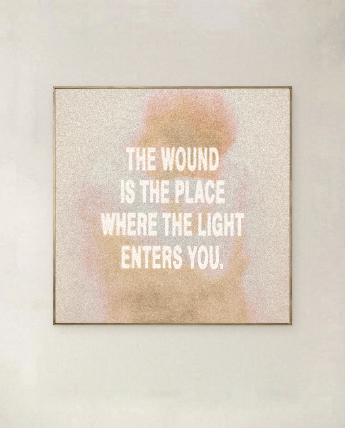 Where The Light Enters, square format - typographic art print in blush and gold, shown in a thin gold frame on a pale wall