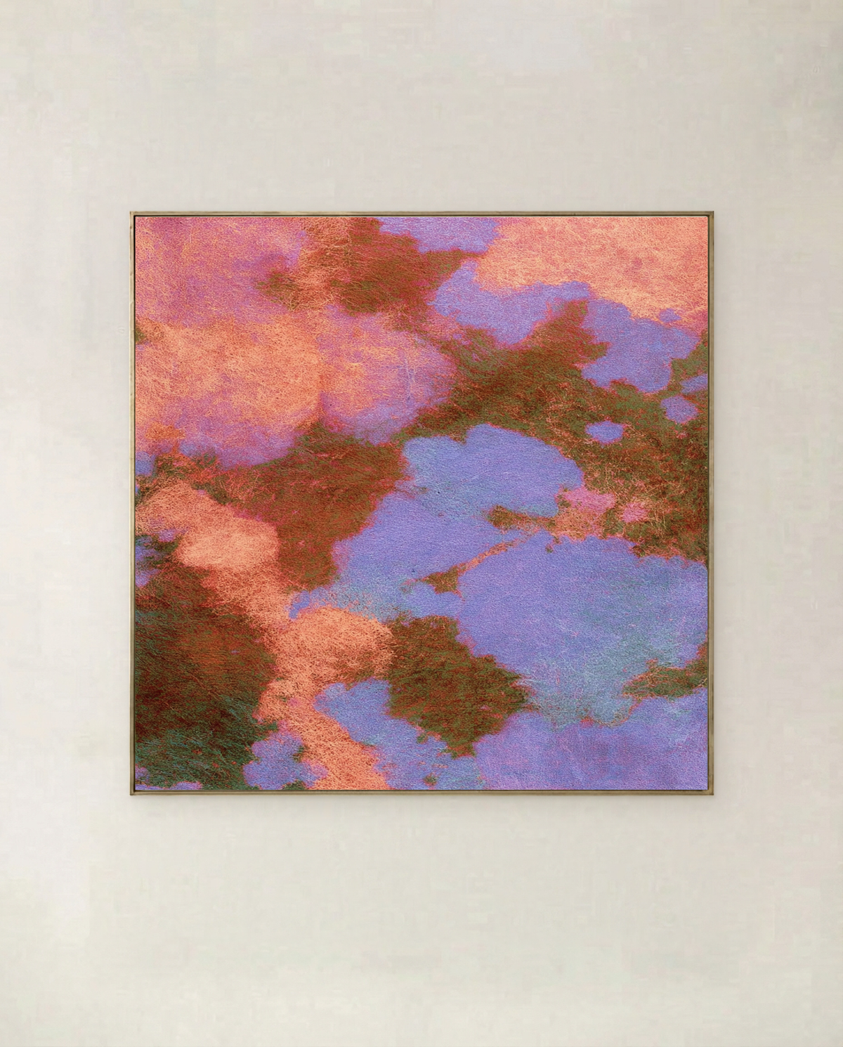 Blossom Canopy - coral and lilac blossom seen from above, threaded with bronze, shown in a thin gold frame on a pale wall