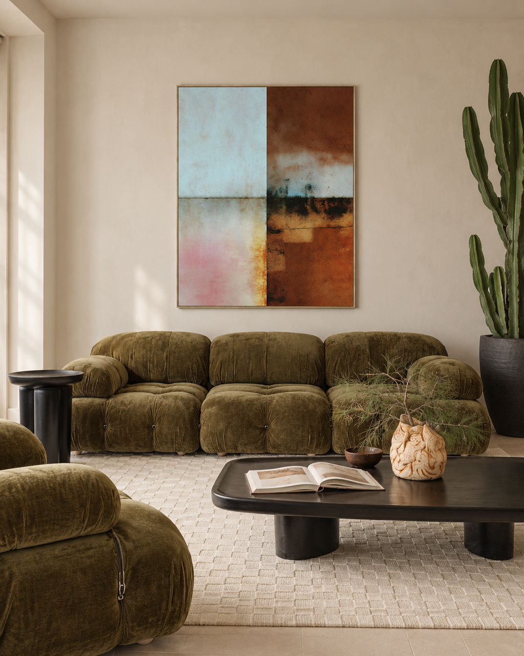 Blue and Umber Bands artwork above an olive velvet sofa