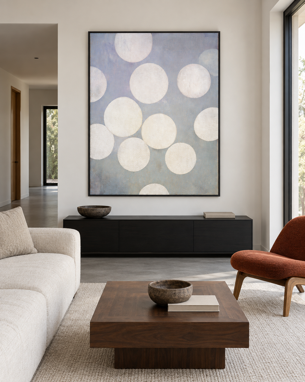 White Circles artwork above a dark sideboard in a quiet living room